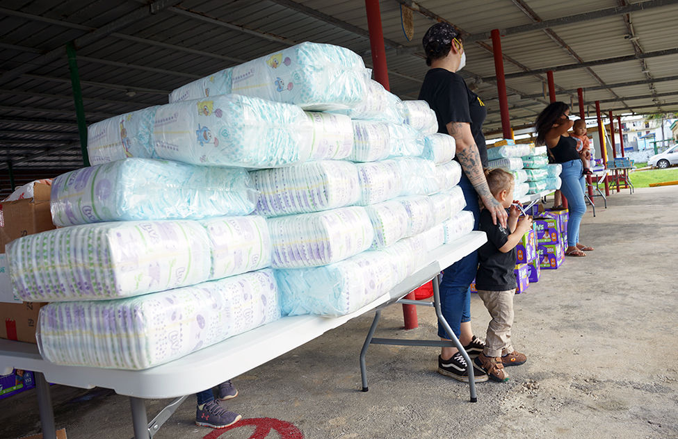 Group distributes baby diapers, wipes